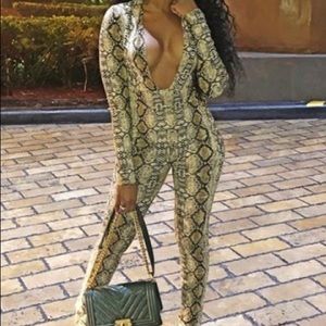 SELLING A SNAKESKIN PRINT JUMPSUIT.